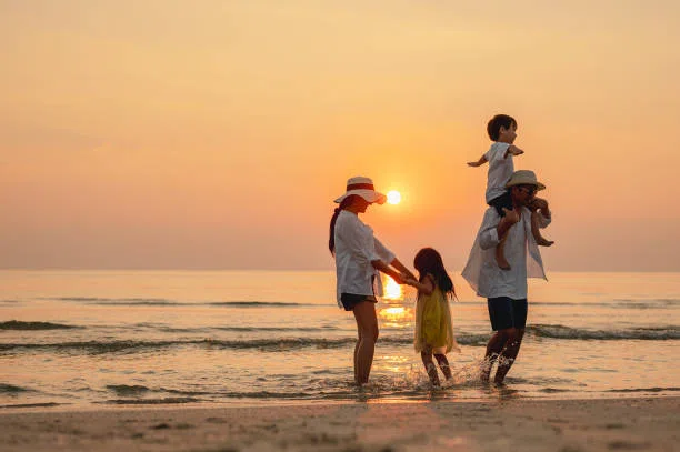 Family enjoying sunrise on Bentota beach