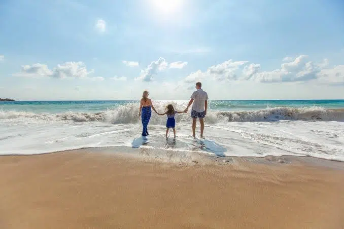 Family relaxing beside the coast in Negombo