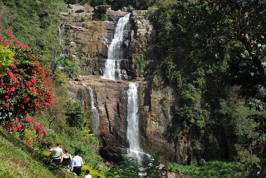 Ramboda Falls beside tea-covered hills