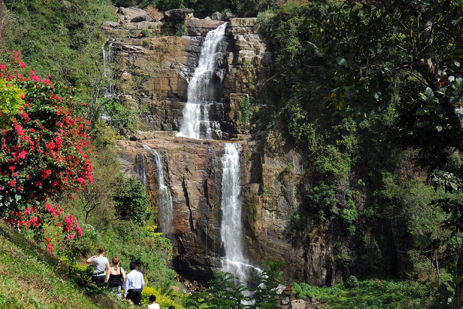 Ramboda Falls beside tea-covered hills