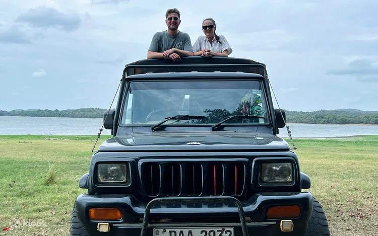 Safari jeep crossing the dry scrubland of Yala