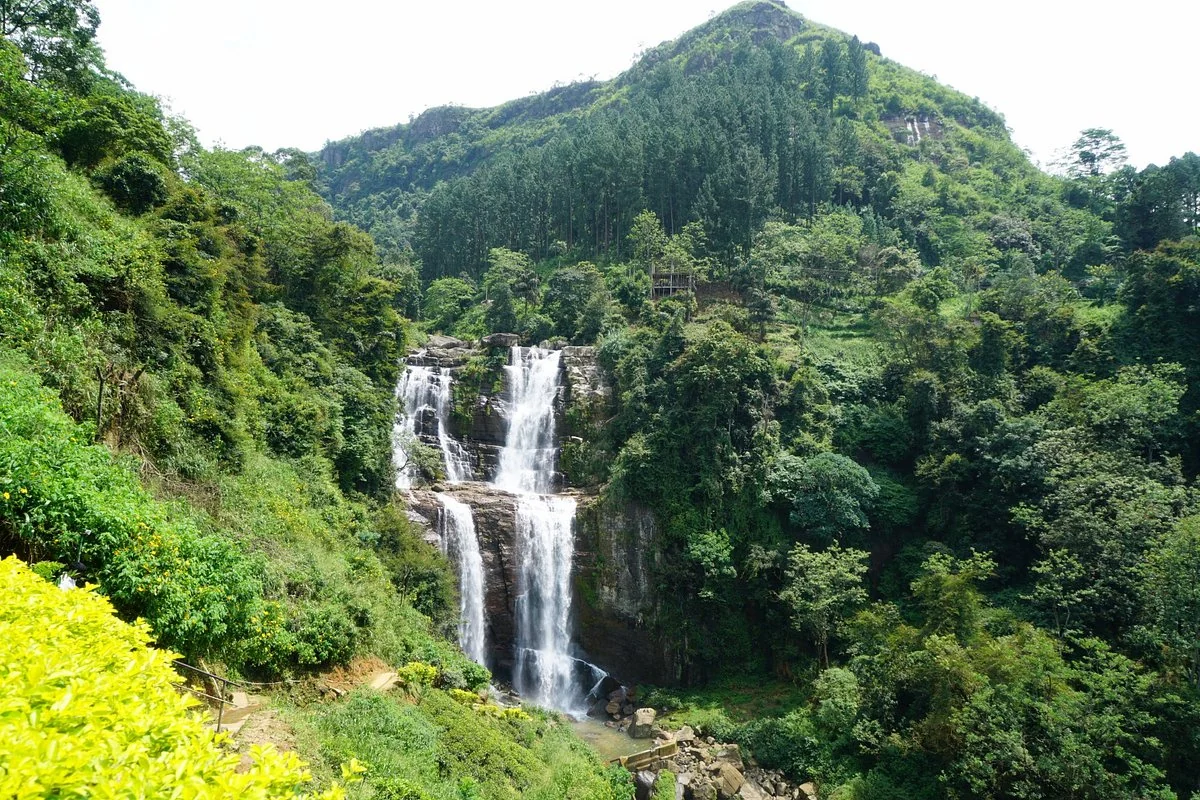 Ramboda Falls beside tea-covered hills